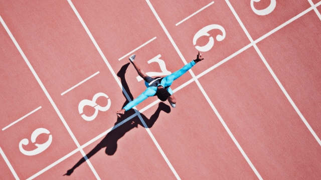 A sprinter crossing the finish line.