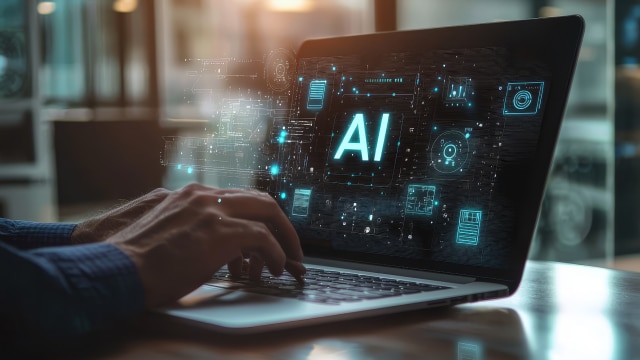 A person using AI on laptop